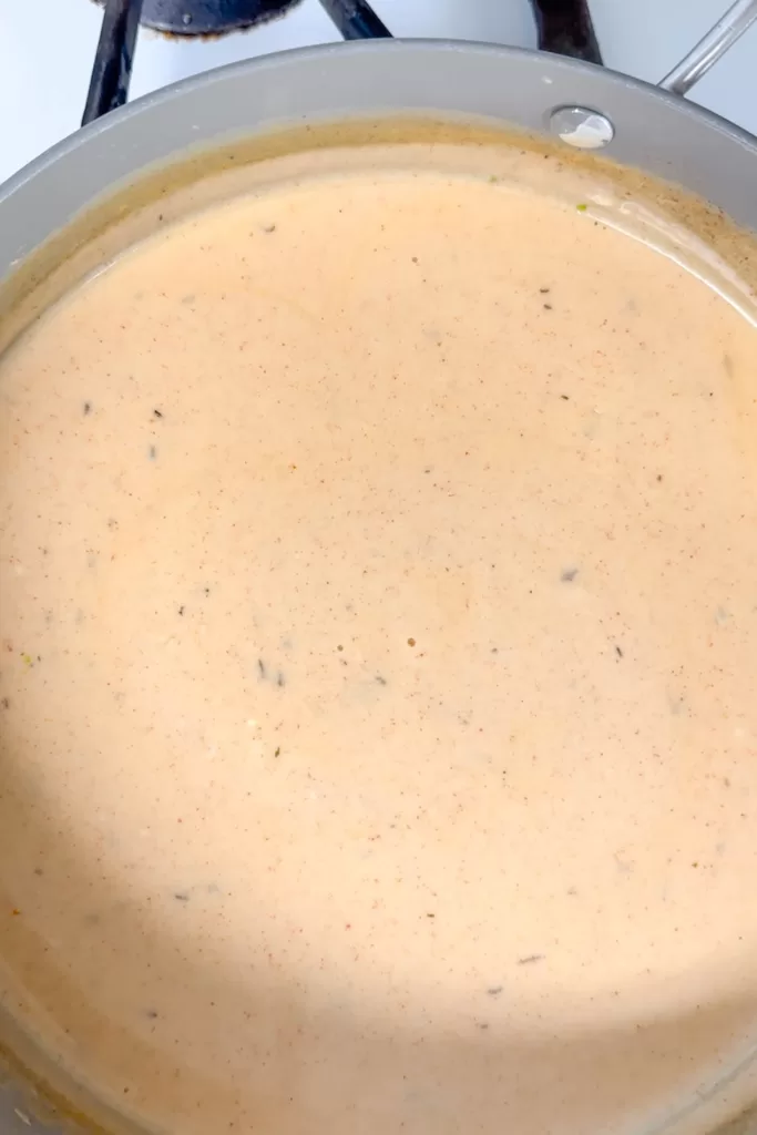 creamy cajun alfredo sauce in a pan